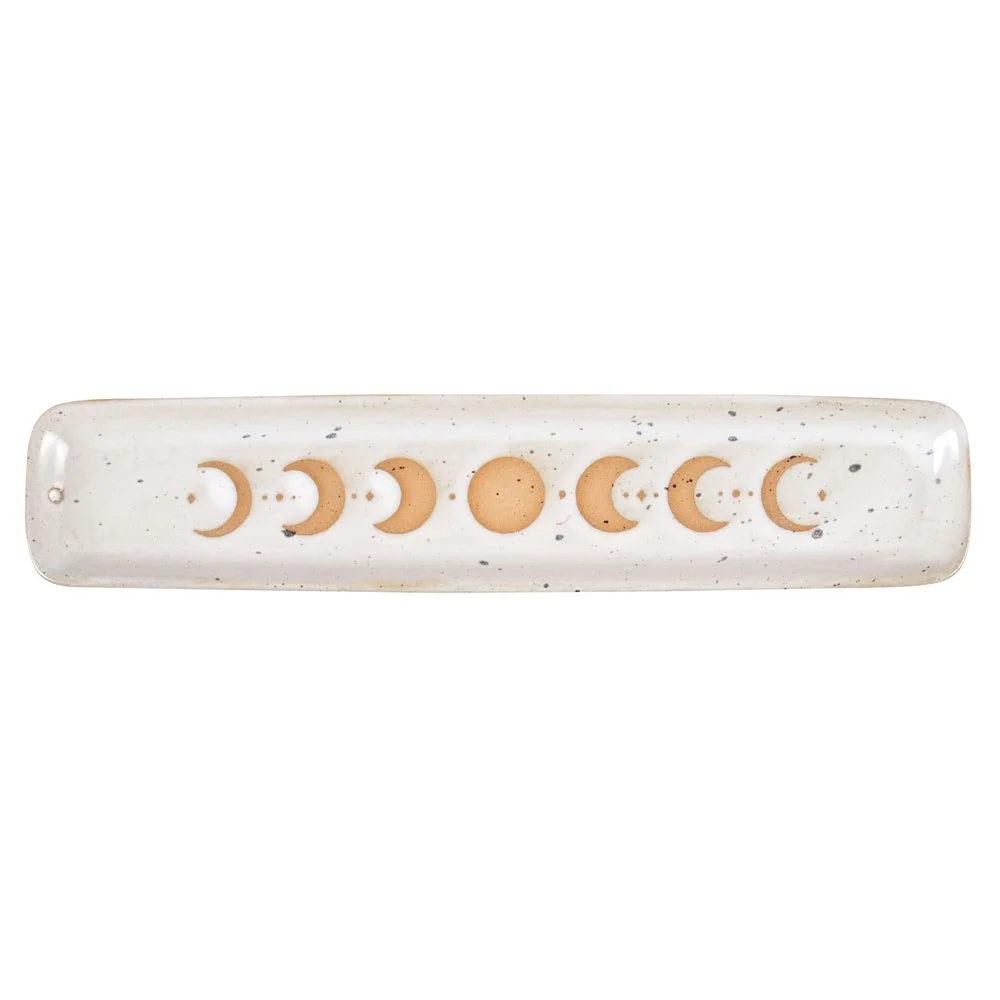 Moon phase ash catcher made of stoneware with wax resist finish showing detailed moon phase design