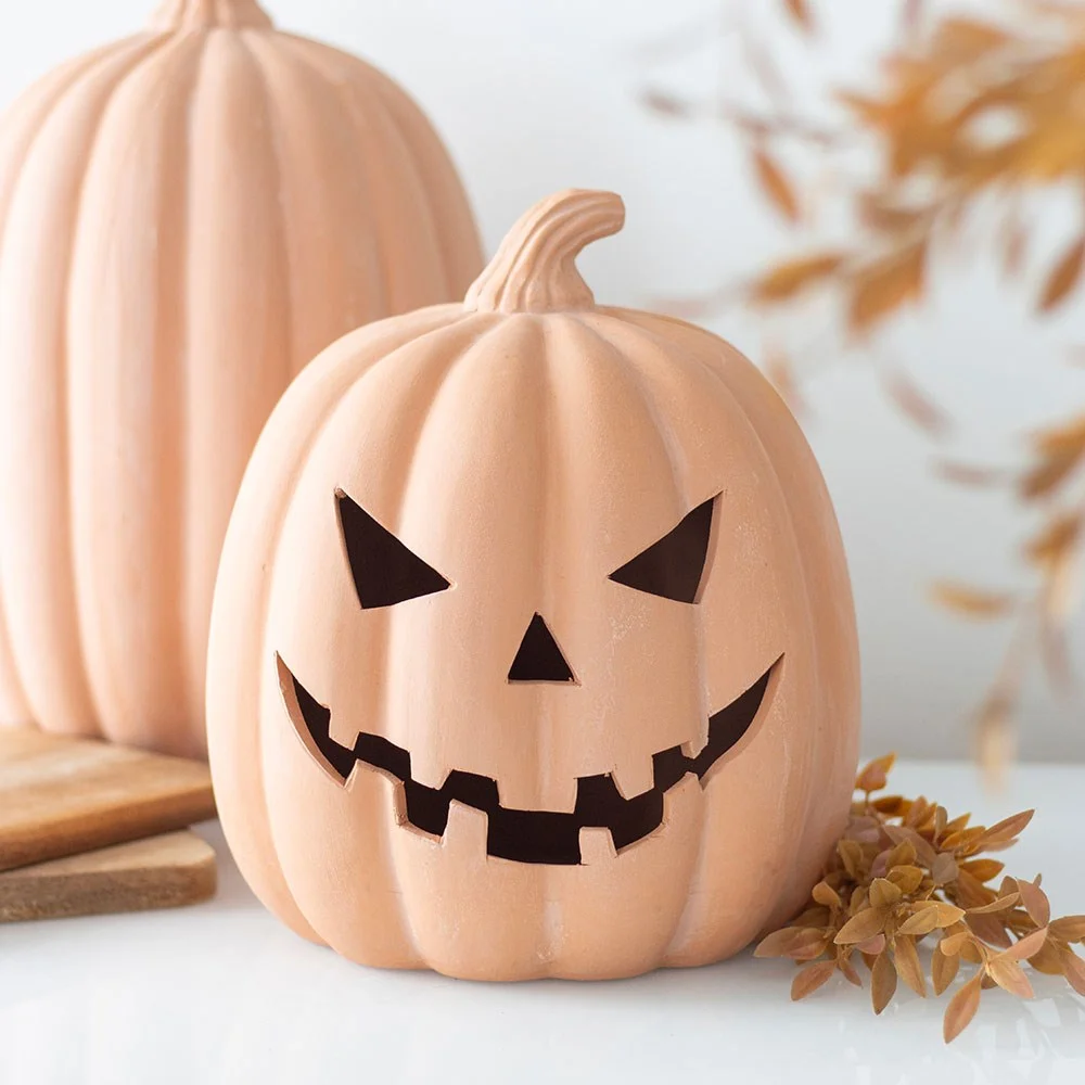 22cm terracotta pumpkin ornament with carved face, ideal for Halloween decoration on doorsteps or indoors