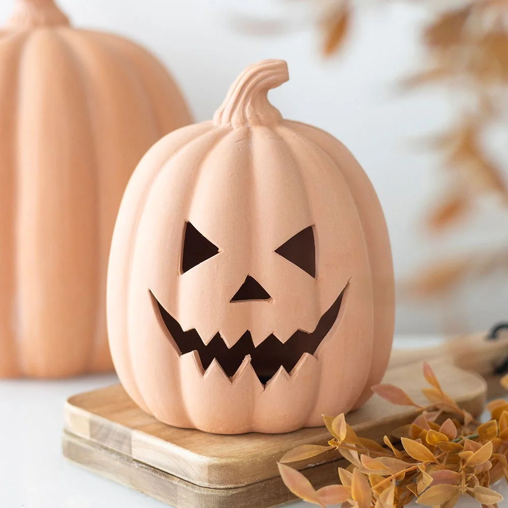 15cm terracotta pumpkin ornament with carved face, ideal for Halloween decoration indoors or outdoors