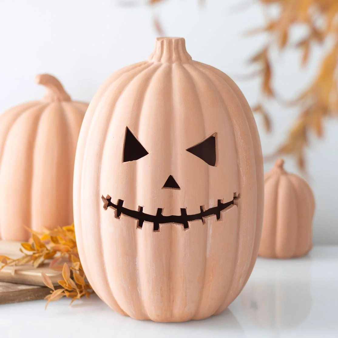 30cm terracotta pumpkin ornament with carved face design, ideal for Halloween decoration indoors or outdoors