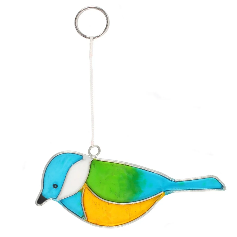 Blue Tit suncatcher hanging in a window, reflecting light onto garden background, crystal‑clear glass shapes.