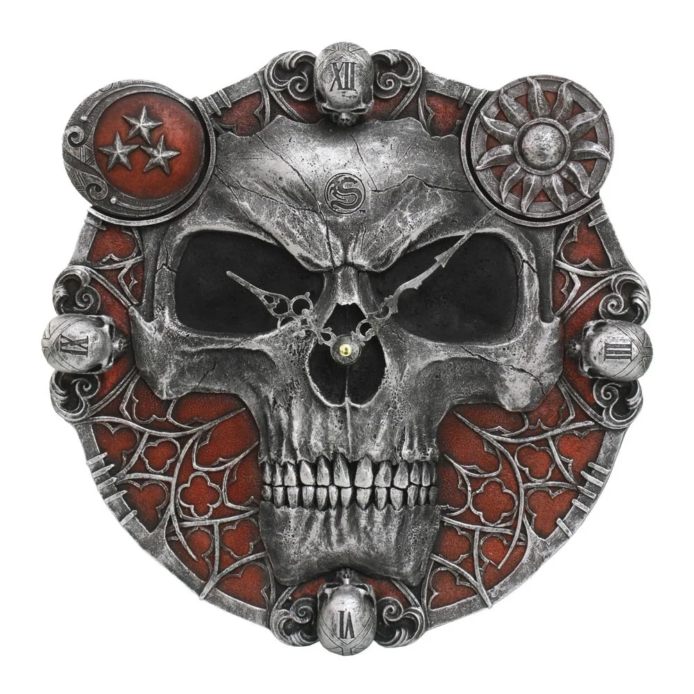 Skull resin wall clock with a skull-shaped face, Roman numerals, and ornate skull decorations on sides