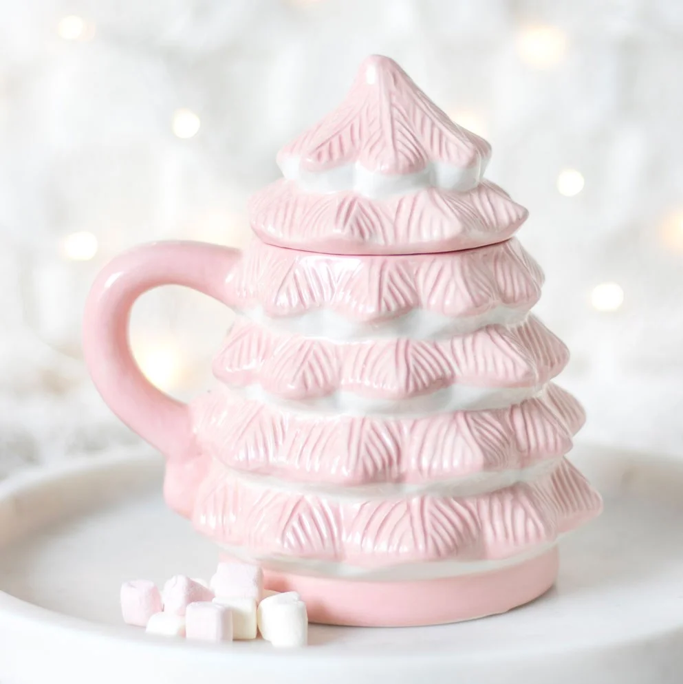 Pink Christmas tree mug with removable lid, ideal for hot cocoa during festive winter days and nights