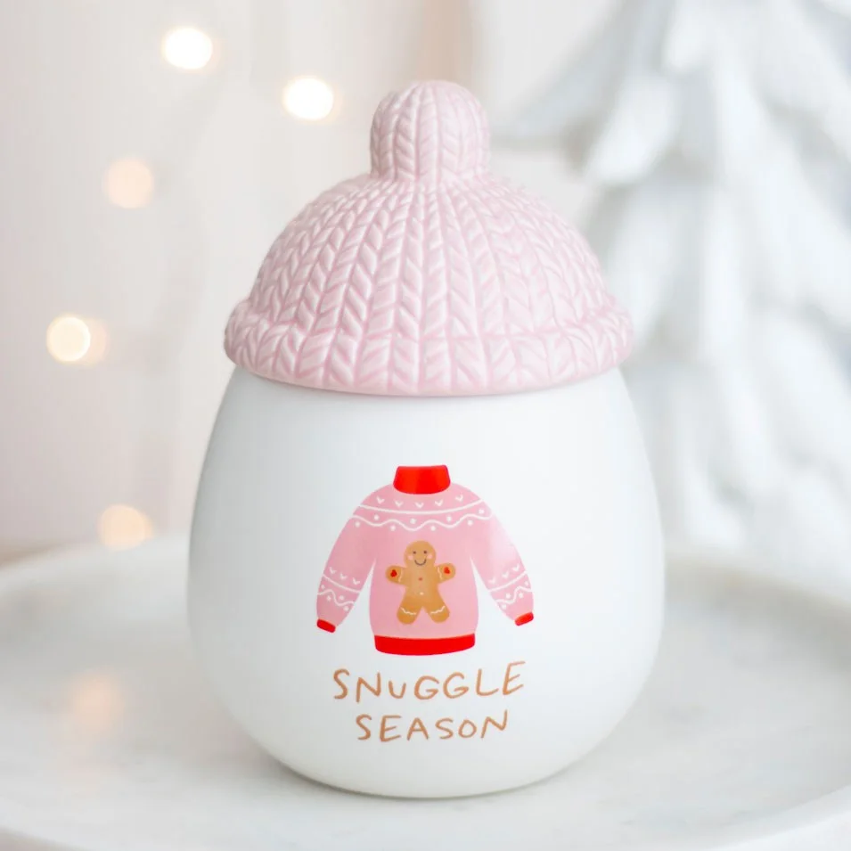 Snuggle Season oil burner with a cosy pink bobble hat lid, designed for festive fragrance oils in winter use