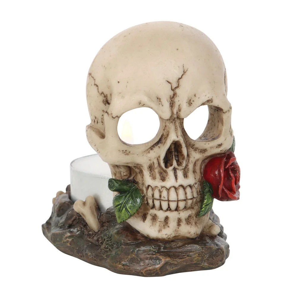 Skull tealight holder with a skull holding a red rose in its teeth, designed for Halloween décor
