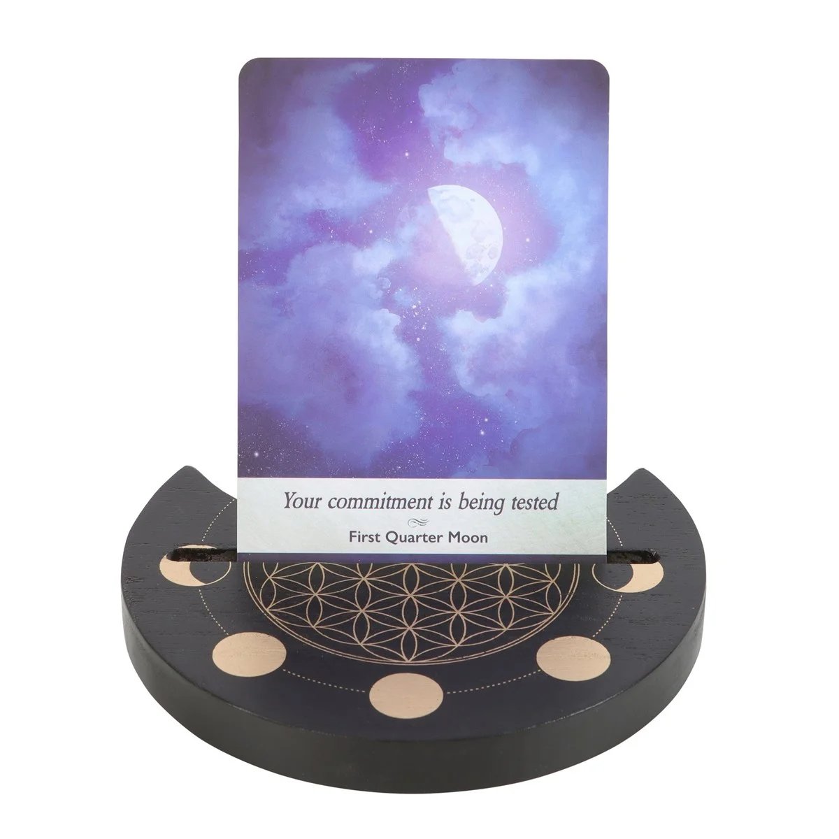 Black wooden tarot card stand with Flower of Life design holding a crescent moon tarot card upright on a white background