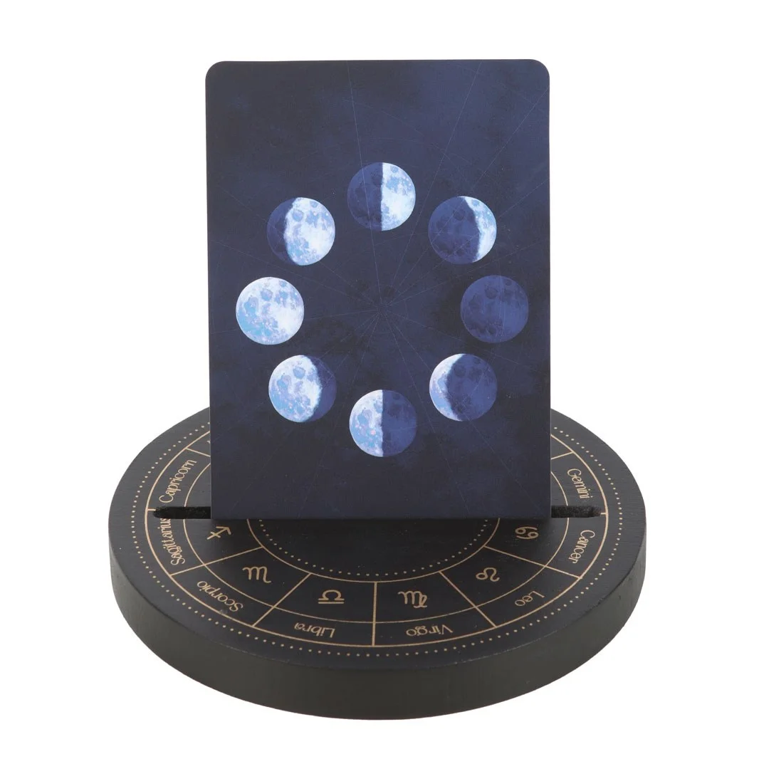 Black wooden tarot card stand featuring an Astrology Wheel design holding a tarot card upright on a white background