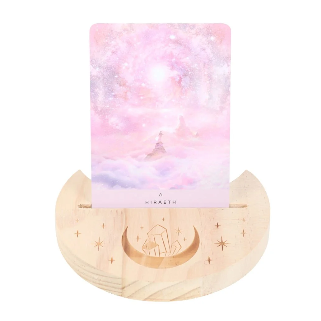 Wooden tarot card stand with a natural crystal crescent moon design holding a tarot card upright on a white background