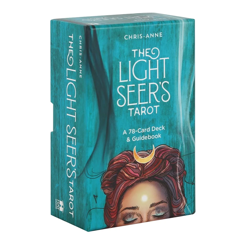 Light Seer's tarot cards deck fanned out next to the illustrated box and guidebook on a white background
