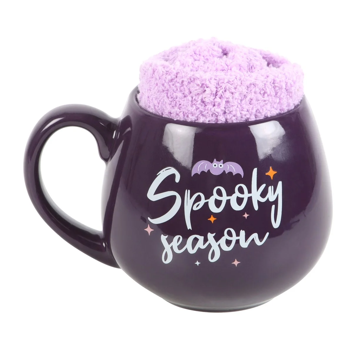 Purple ceramic mug with "Spooky Season" text and lilac fluffy socks inside, part of spooky season mug set