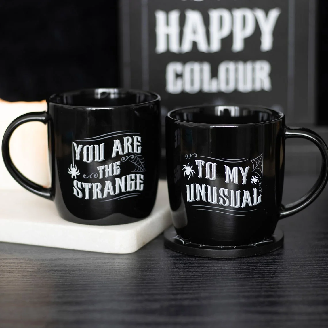 Pair of gothic couple mug set with "You are the strange" and "to my unusual" text, 350ml capacity each