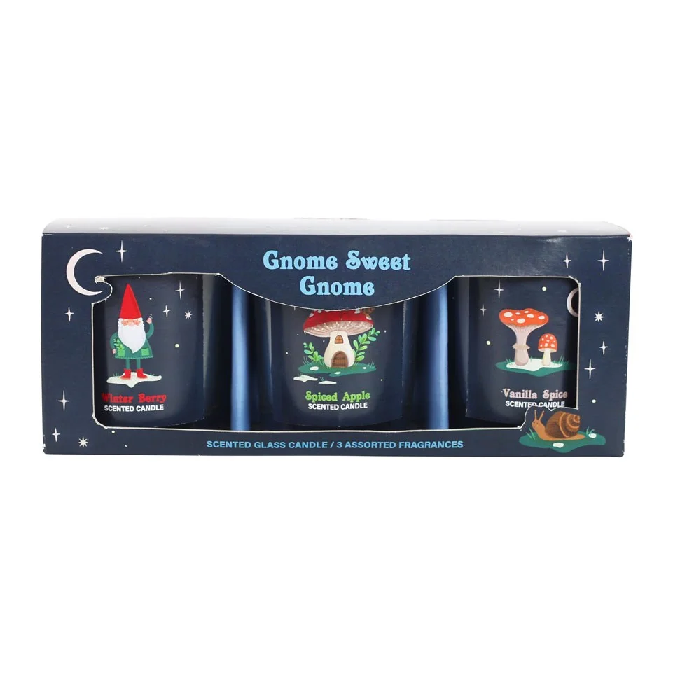 Scented candle trio with gnome, mushroom house, and toadstools designs in winter forest theme on white background