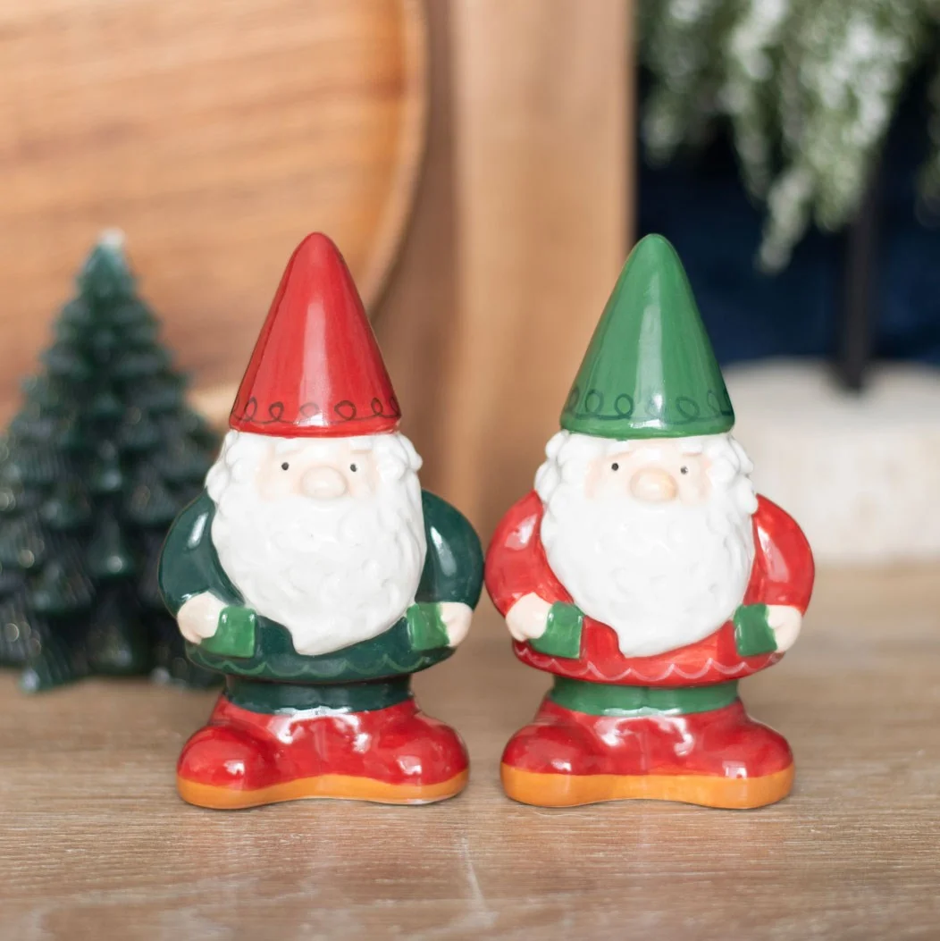 Pair of colorful gnome salt and pepper shakers with detailed hats and beards on a white background