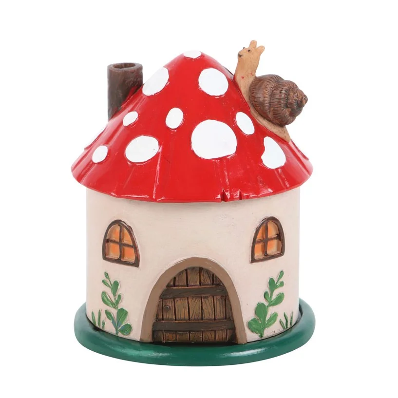 Mushroom incense burner shaped like a small house with chimney, designed for burning resin incense cones indoors