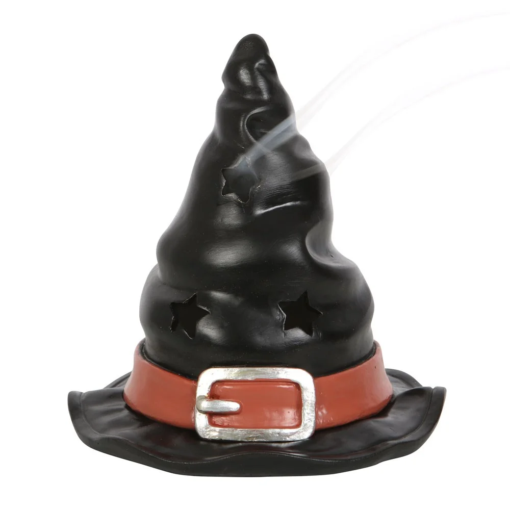 Black ceramic witch hat incense burner with a smouldering cone and rising smoke swirls on a white background