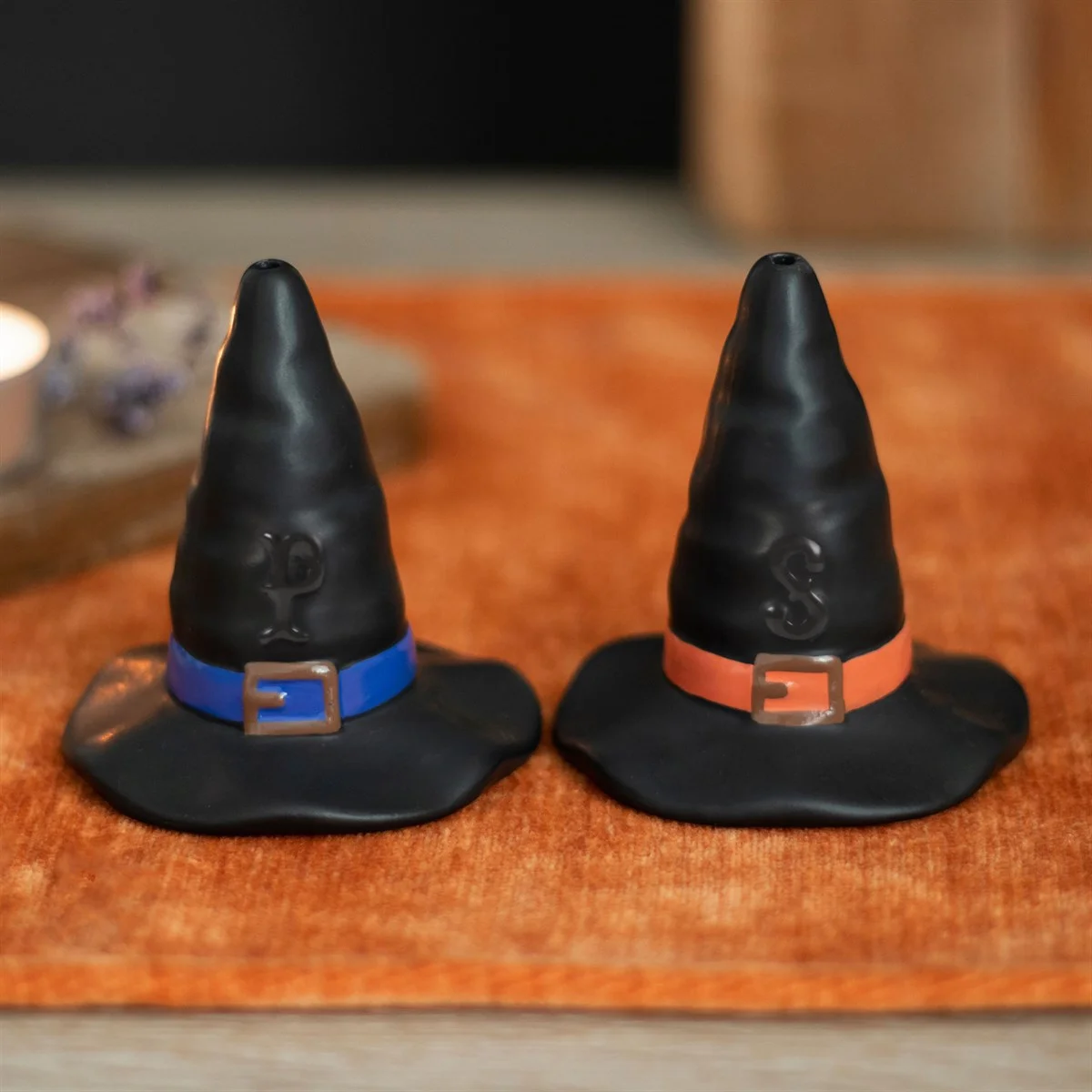 Pair of black witch hat salt shakers shaped like classic pointed hats, perfect for Halloween kitchen decor