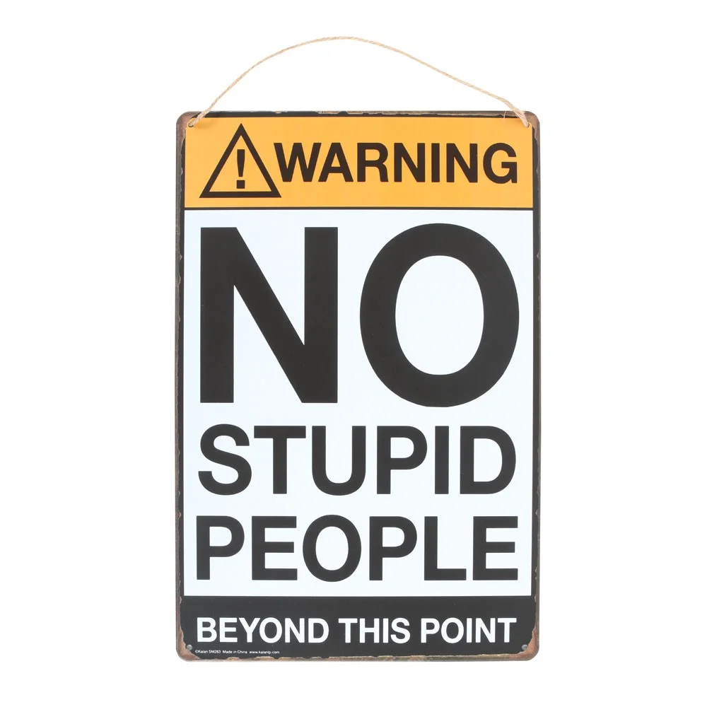 No Stupid People sign – metal plaque with black text on a white background.