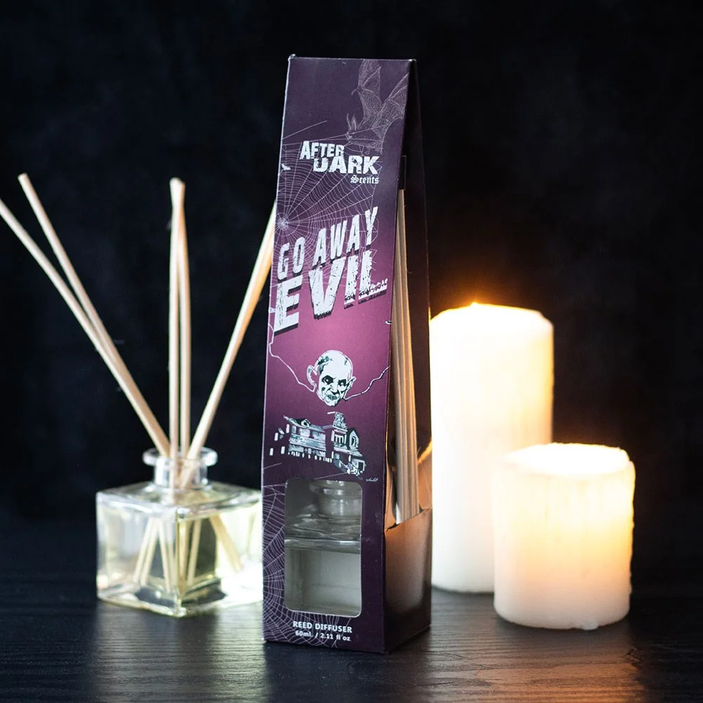 Go Away Evil rose reed diffuser with black reeds and 60ml fragrance oil bottle from After Dark collection