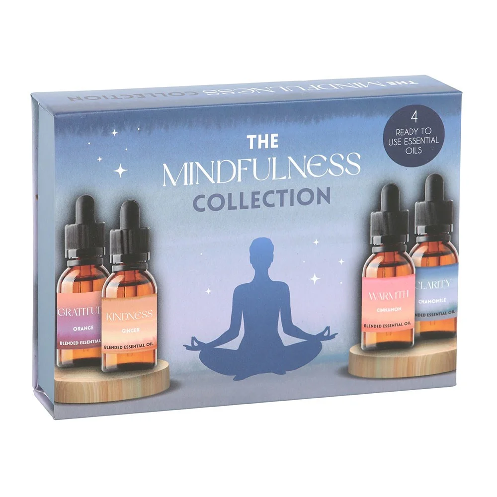 Four 10ml bottles with droppers in a blended essential oil set featuring Gratitude, Kindness, Warmth, and Clarity scents