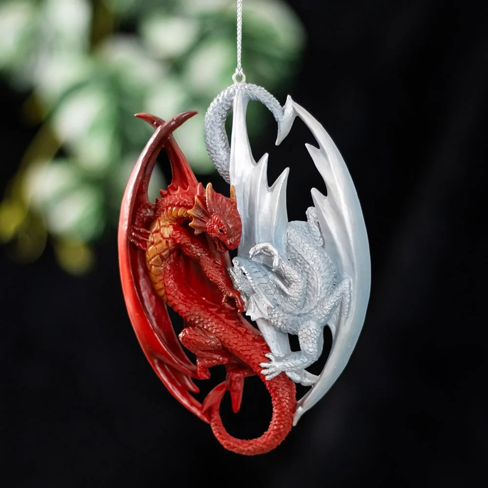 Fire and ice dragon ornament showing two entwined dragons in red and blue, hanging with a loop for display or Christmas tree decoration