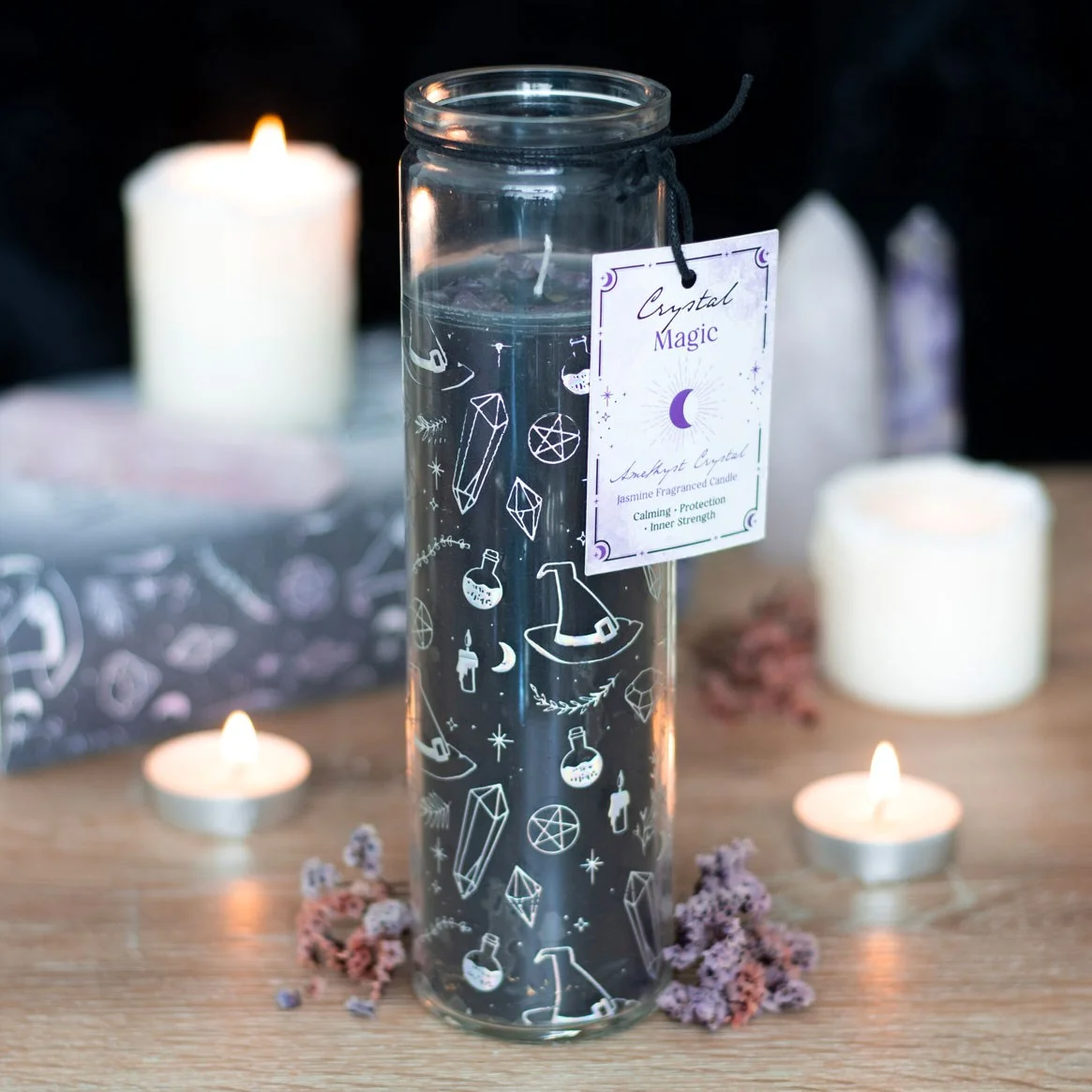 Tube candle with jasmine scent, decorated with amethyst chips and mystical witchcraft-themed designs