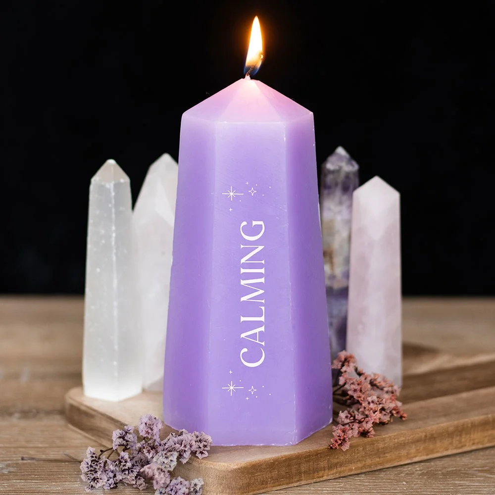 Purple tower-shaped calming crystal candle with rough amethyst inside, offering up to 30 hours burn time