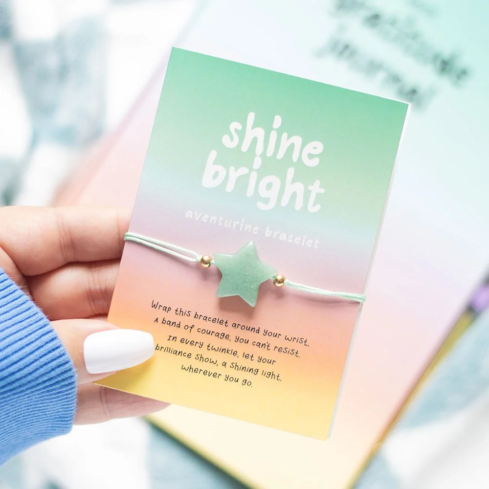 Green aventurine crystal bracelet with star charm displayed on a 'Shine bright' backing card with poem text