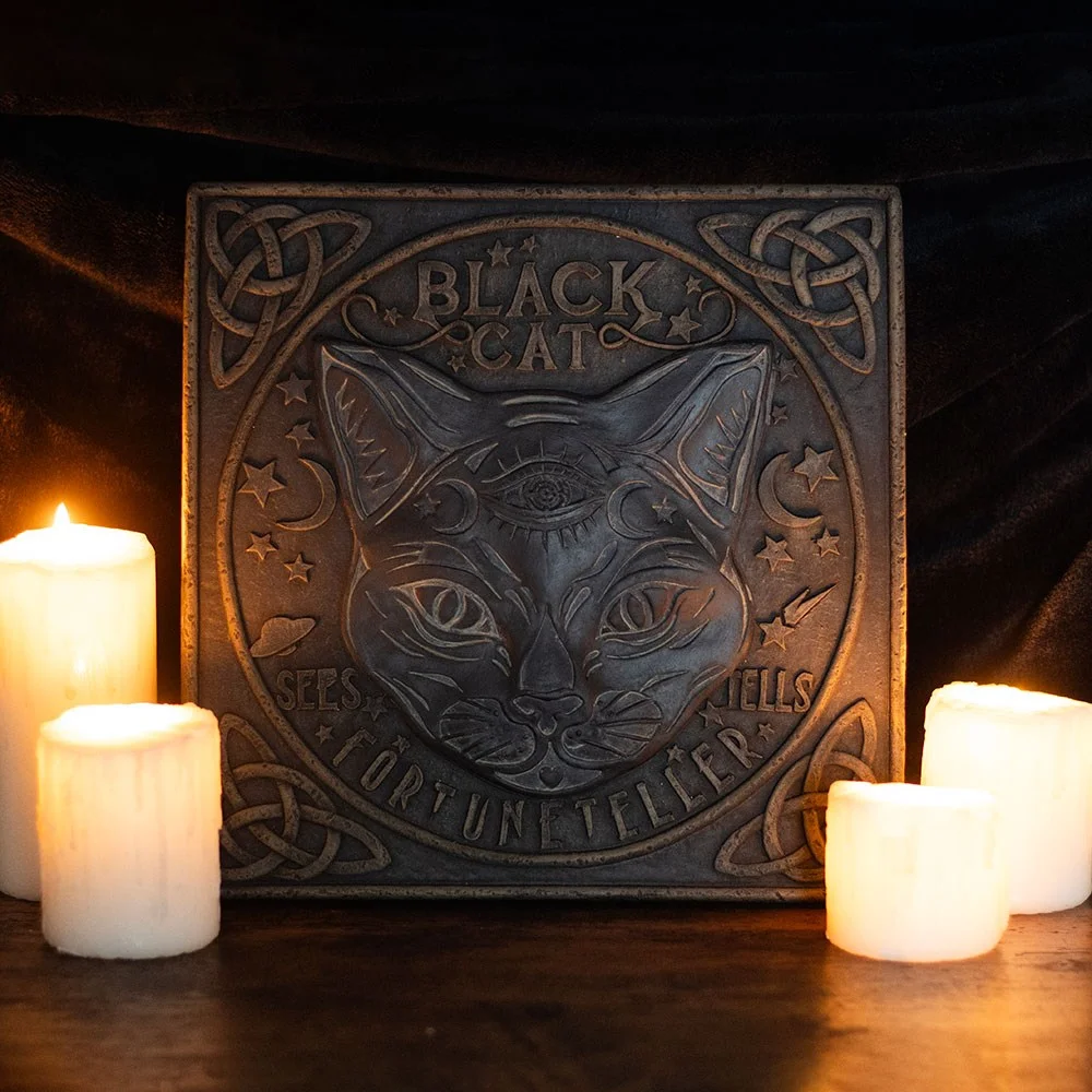 Black cat stepping stone with celestial moon and star details, designed as a fortune teller sign for decorative use