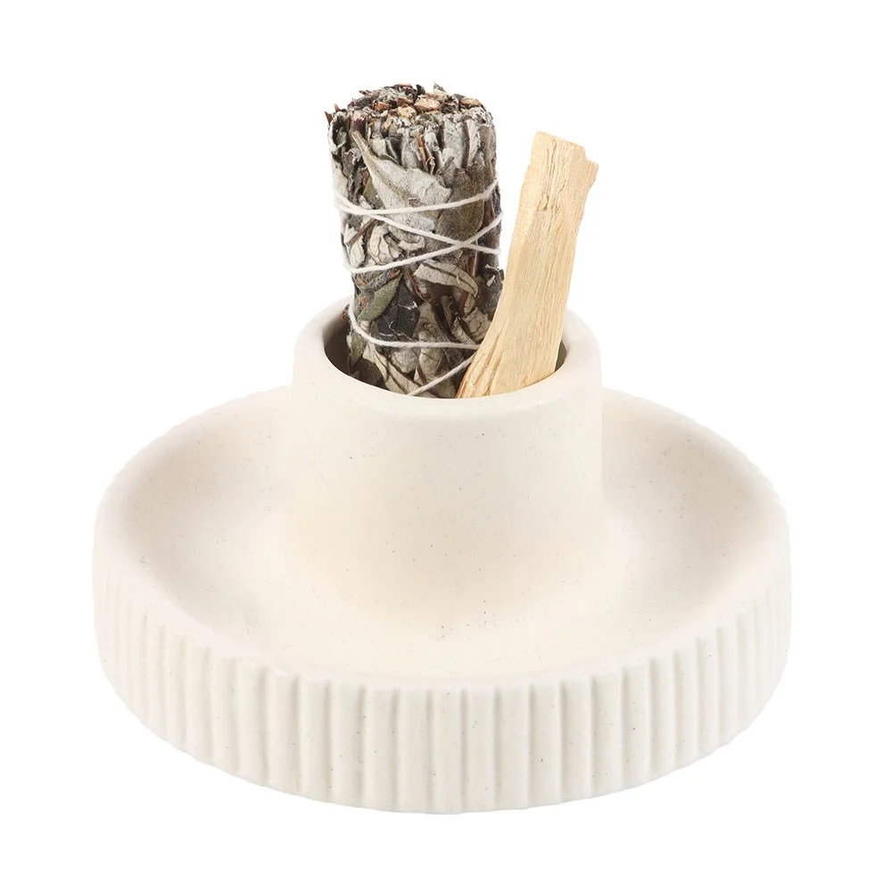Cream ribbed ceramic smudge bowl on a simple background, showing its smooth white surface with subtle ribbed texture