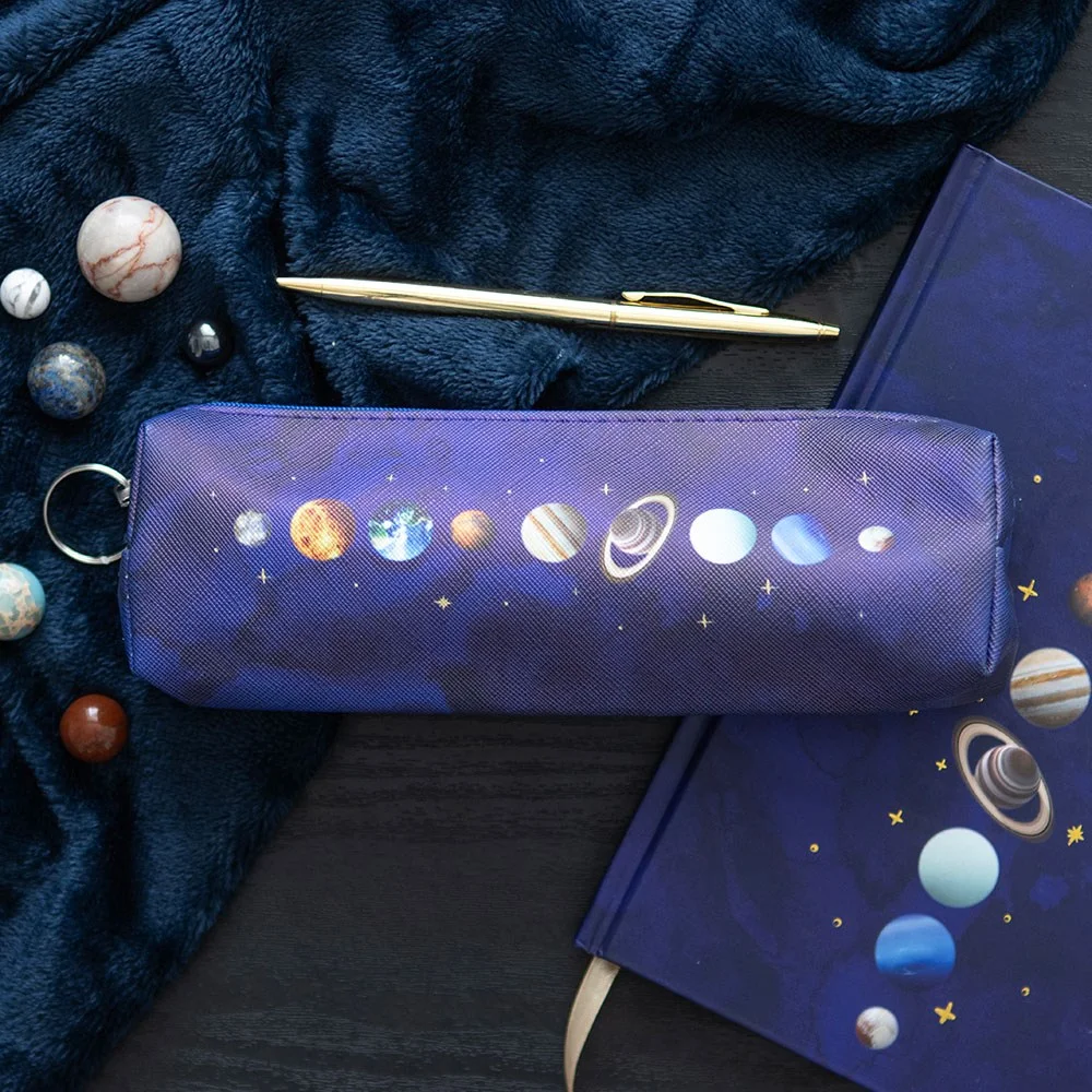 Solar system pencil case with gold stars on deep blue background featuring planets and celestial design