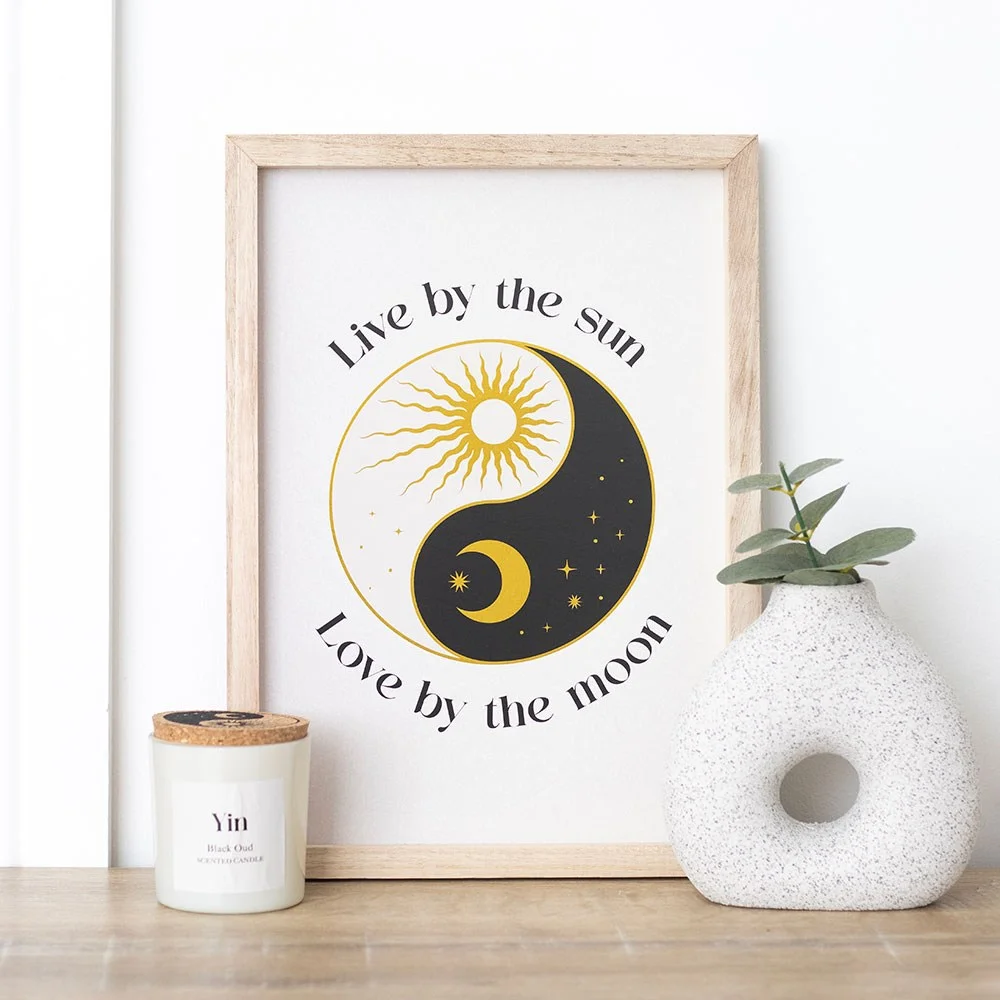 Framed yin yang wall art print with celestial design and "Live by the sun, love by the moon" inspirational text