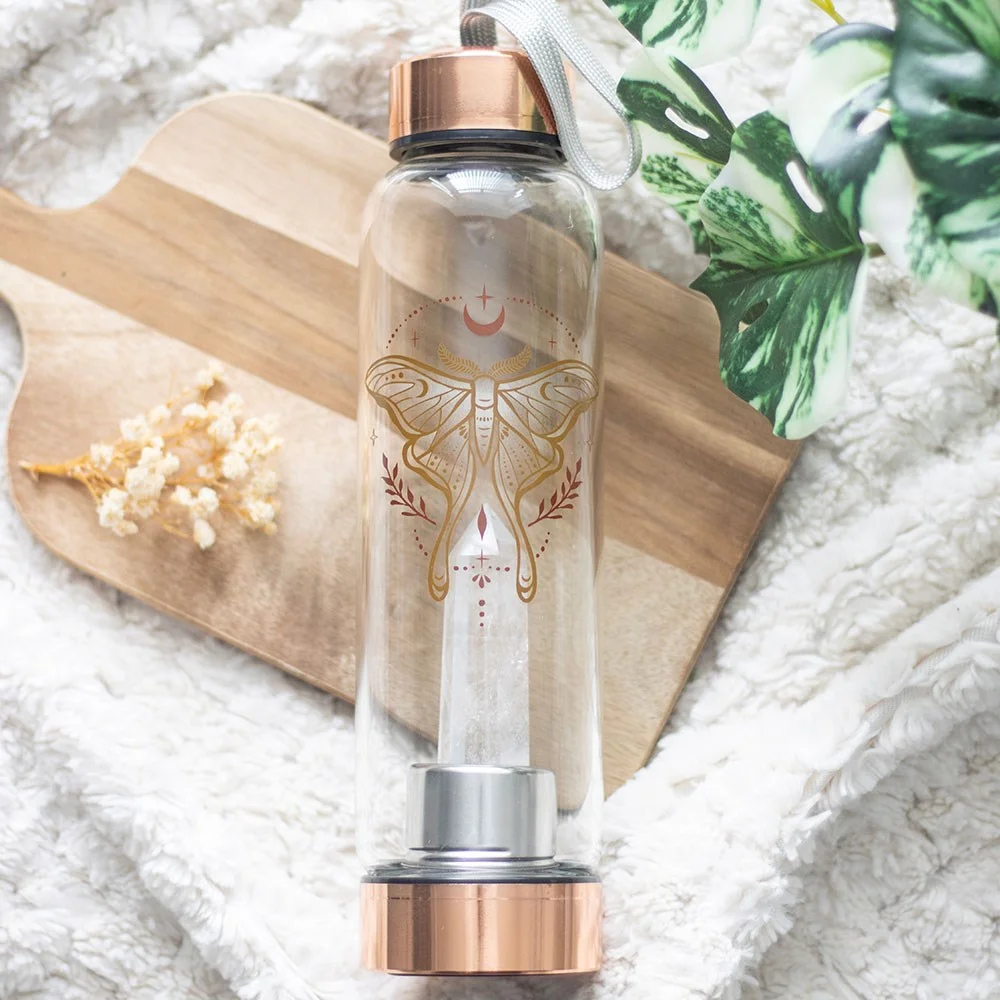 Glass water bottle with luna moth design, clear quartz crystal inside, stainless steel lid, and neoprene cover, 500ml capacity