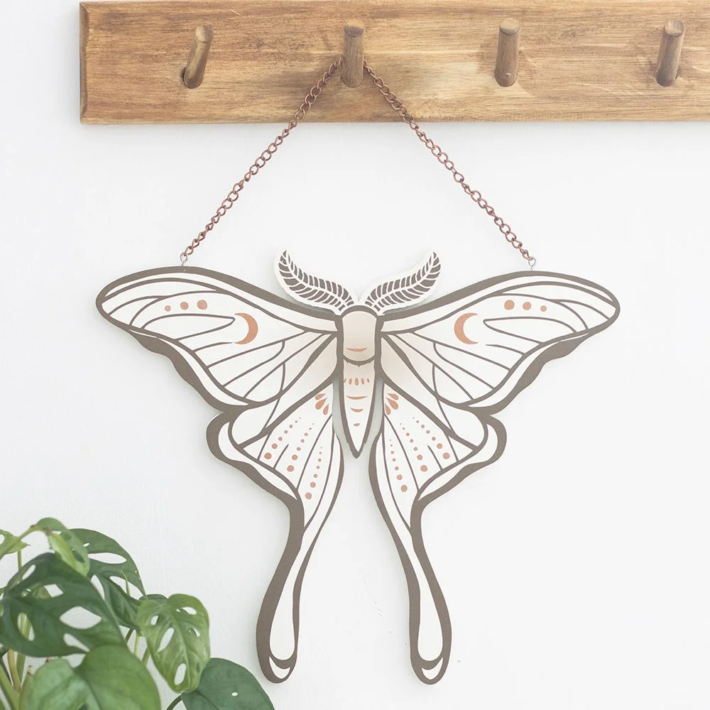 Delicate luna moth hanging sign with intricate wings, displayed against a plain background for room decoration.