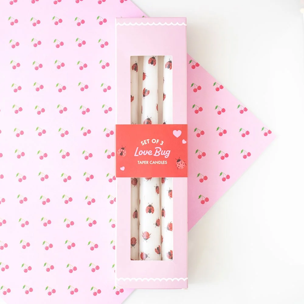 Set of 3 white love bug taper candles with ladybird design, ideal for Valentine’s Day decor and gifts