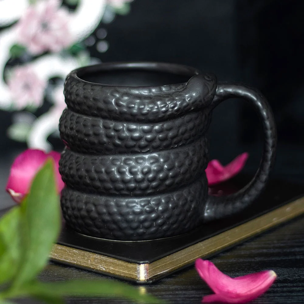 Black snake mug with a coiled snake design, 500ml capacity, black ceramic, microwave safe, hand wash only.