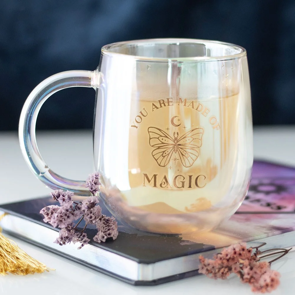 Iridescent glass mug with double walls, gold "You are made of magic" text, and mystic butterfly design, 300ml capacity