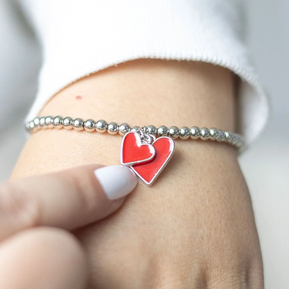 Red enamel heart charm bracelet with beads, symbolizing love and perfect as a gift for Valentine's or Mother's Day