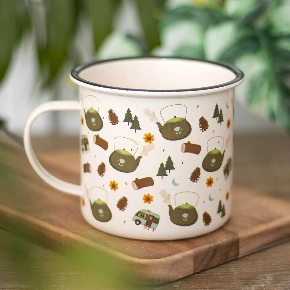Camping enamel mug with woodland print featuring trees, logs, tea kettles, and caravans, 550ml capacity.