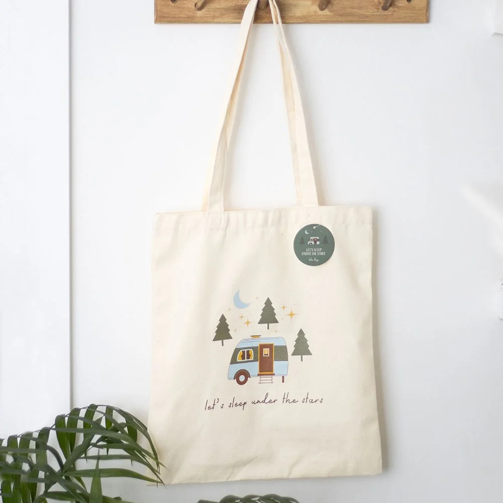 Polycotton tote bag with caravan design and "Let's sleep under the stars" text for camping lovers