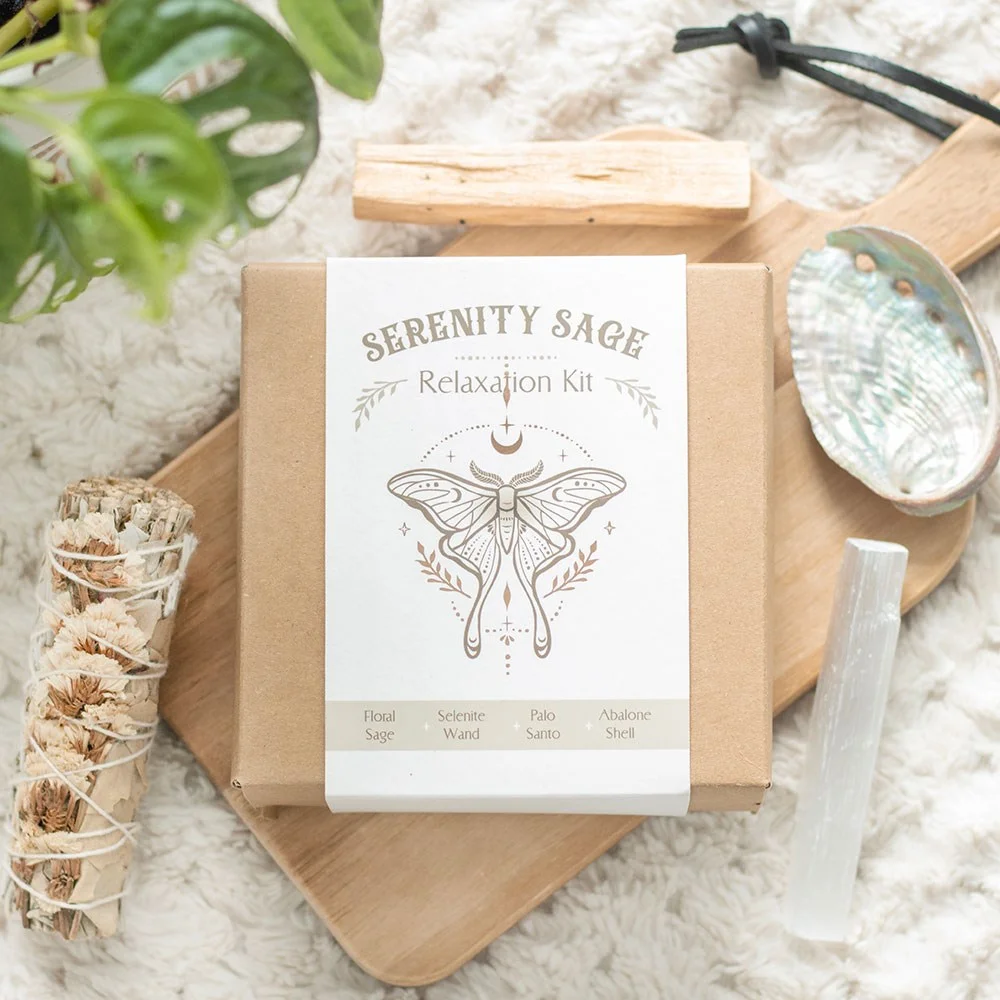 Serenity Sage Relaxation Smudge Kit with white sage bundle, selenite wand, palo santo stick, abalone shell, and gift box
