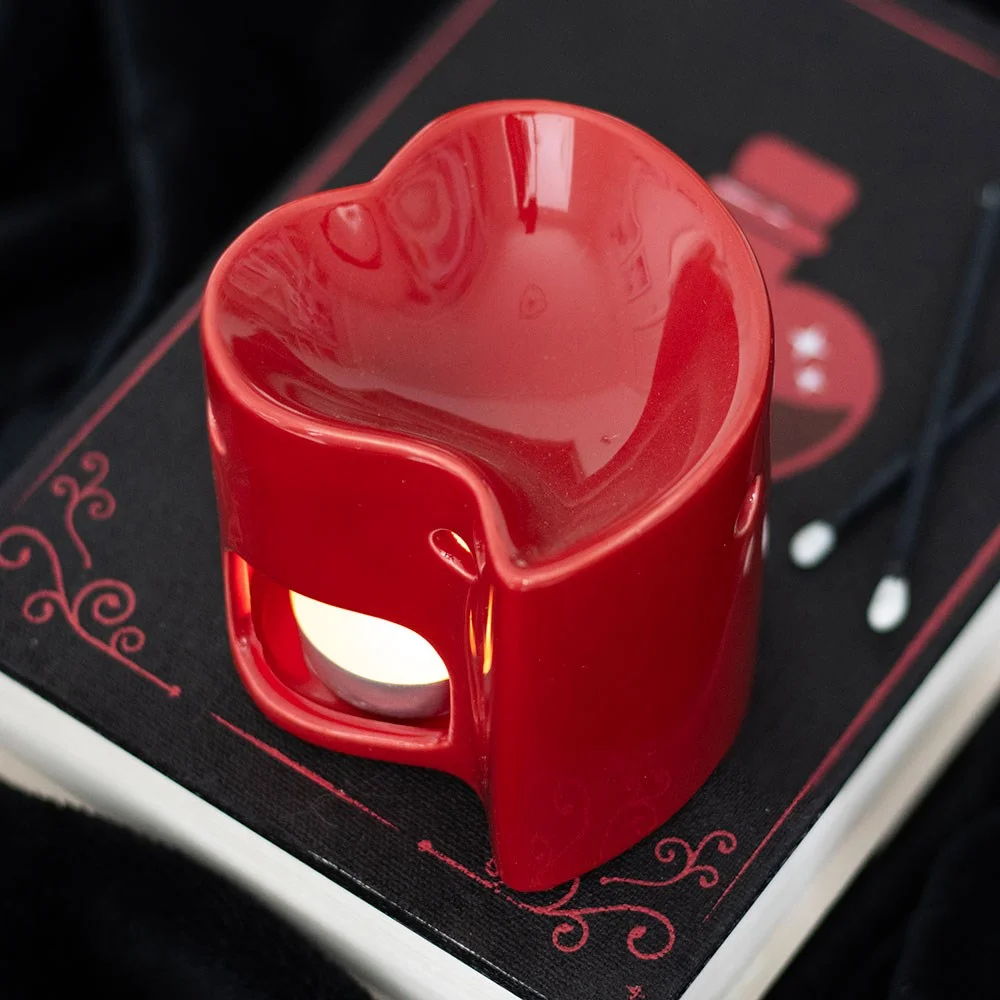 Red heart ceramic oil burner with tealight holder, ready to hold a standard tealight and a romantic scent.