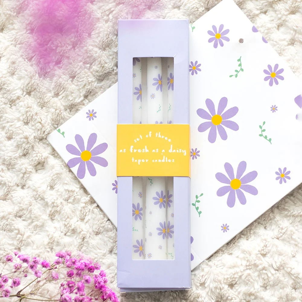 Set of 3 purple daisy taper candles with floral design, ideal for spring decor and table settings, unscented wax