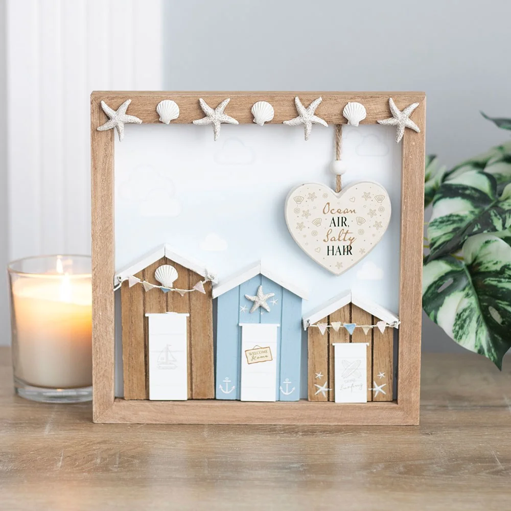 Beach hut wall plaque with three colorful huts and text "Ocean air, salty hair" on MDF material