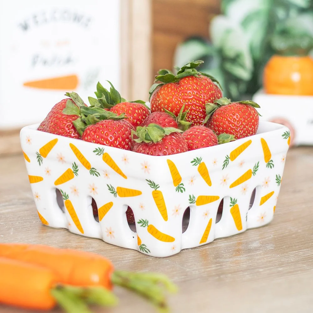 Ceramic berry basket with carrot and daisy design, ideal for storing fresh produce or serving snacks outdoors