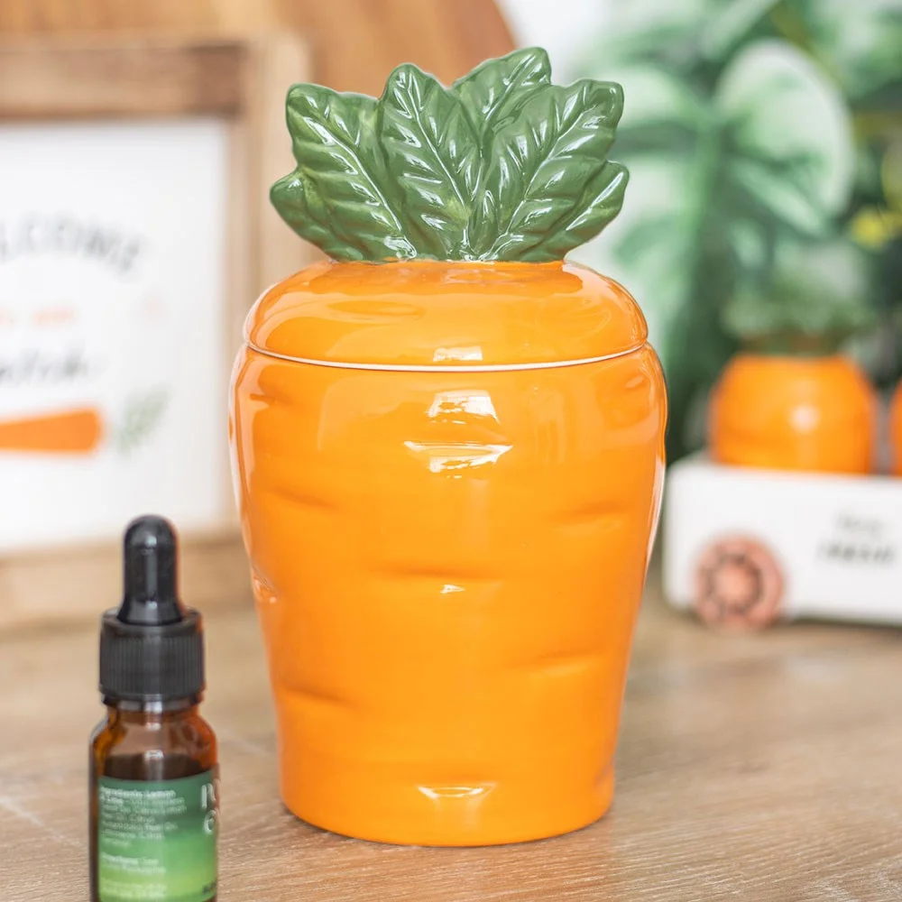 Carrot-shaped oil burner with removable top for wax melts, designed as a quirky carrot oil burner for home decor