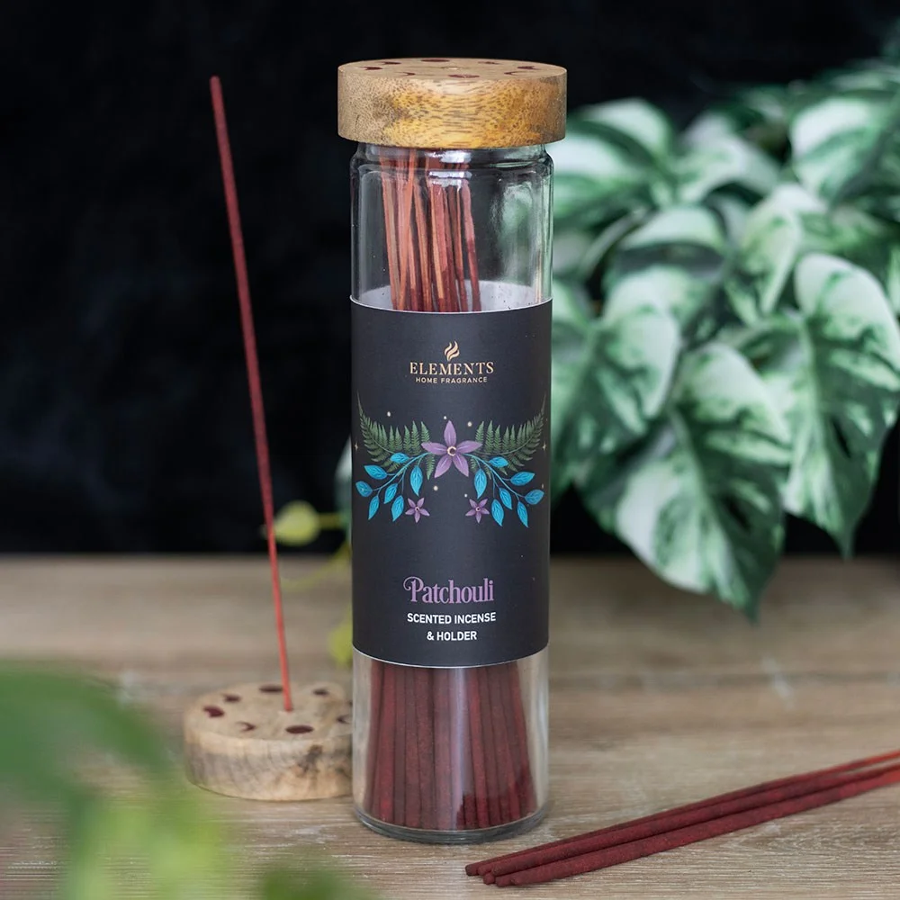 Dark Forest Patchouli incense sticks with floral tube design and wooden lid holder on white background
