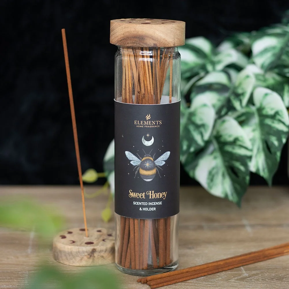 Tube of Dark Forest sweet honey incense sticks with wooden lid and mystical forest bee design on packaging