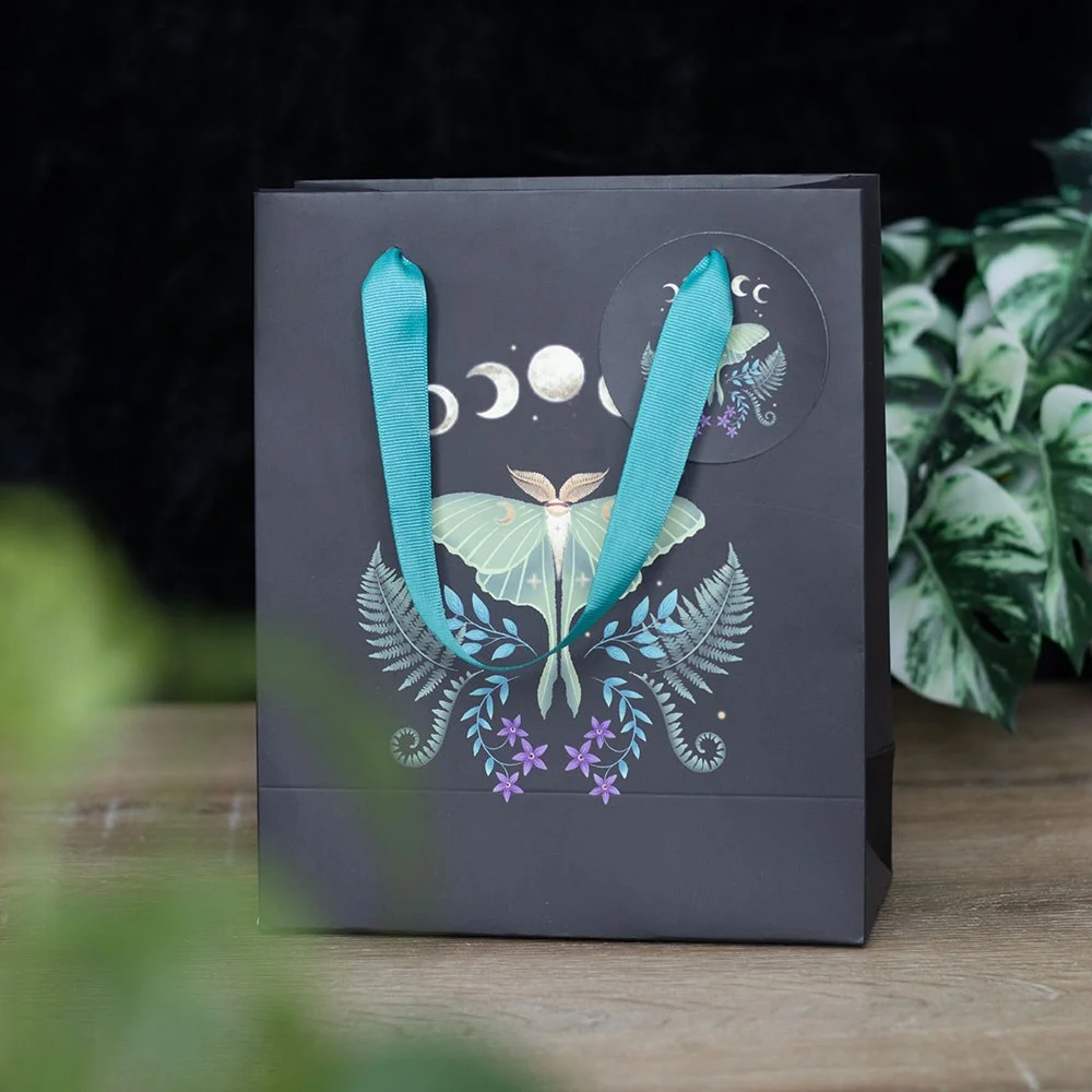 Medium luna moth gift bag with mystical luna moth and moon phase design, 23cm tall, white background.