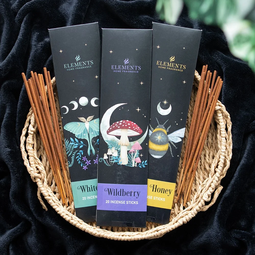 Set of 3 dark forest incense sticks packs with wild berry, sweet honey, and white sage fragrances in decorative boxes
