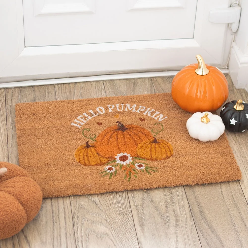 Coir pumpkin doormat with autumn pumpkin illustration and 'Hello Pumpkin' text, cool earthy tones